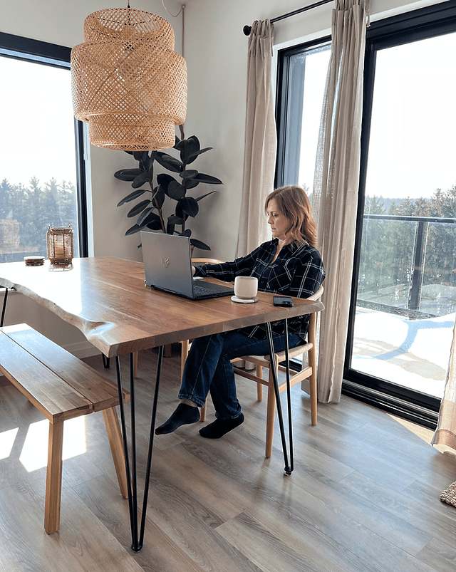 Sherry Hergott at her desk in a bright modern office